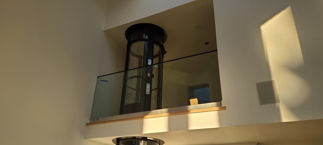 round glass elevator enclosure - distinctive